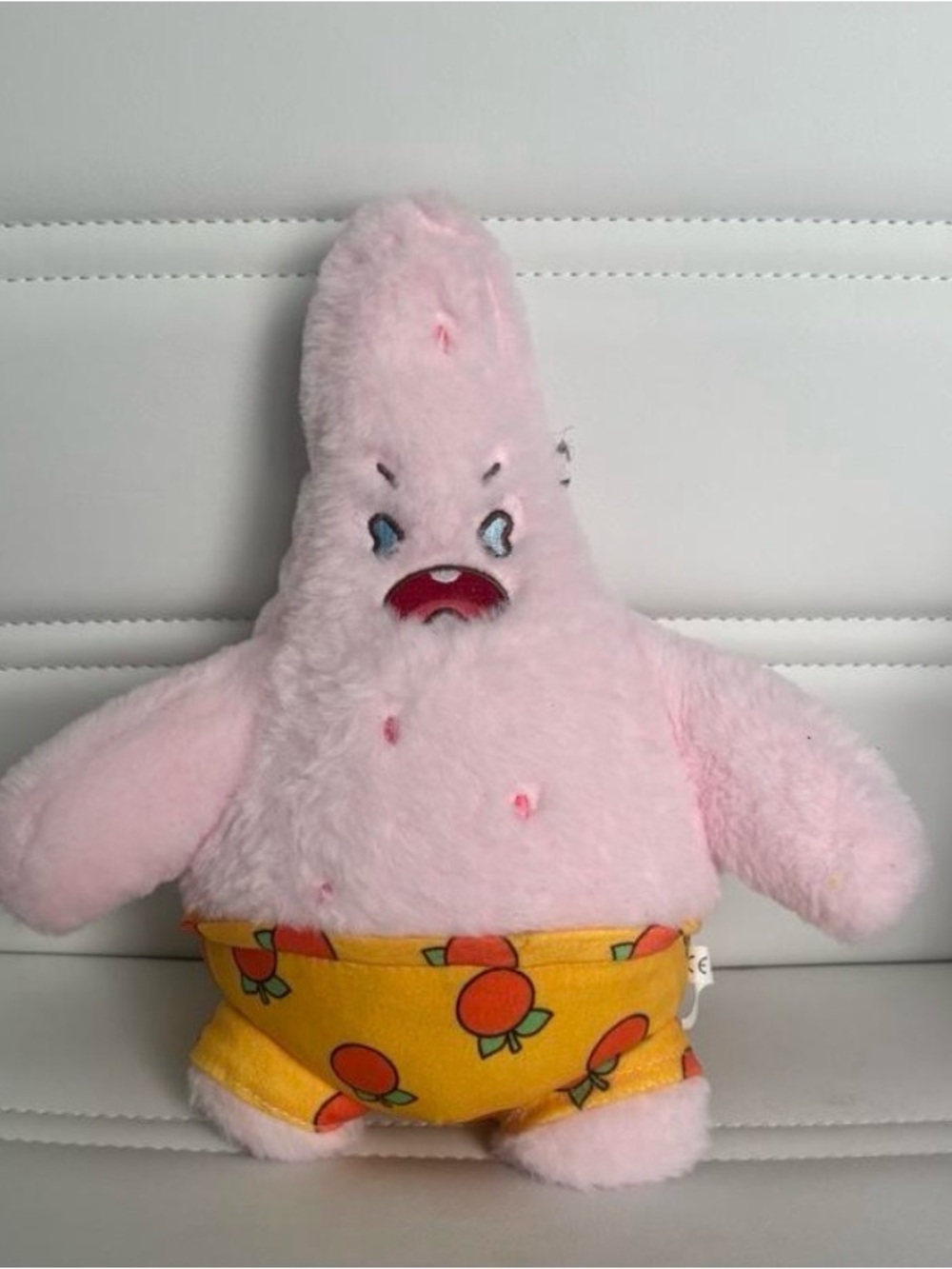 Pink Plush Star Character Toy with Orange Print Shorts